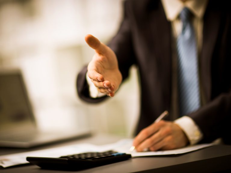 Successful,Businessman,Giving,A,Hand